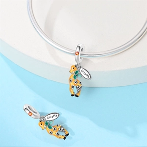 Detail of enamel giraffe charm with green leaves and orange gemstone for DIY bracelet