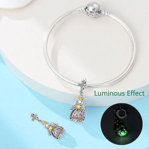 Luminous angel wing cage pendant on silver snake chain bracelet with glowing bead