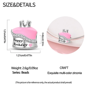 Close-up of Happy Birthday pink enamel cake bead with silver crown and cubic zirconia