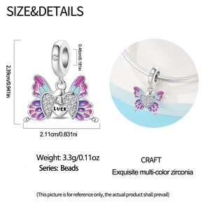 Detail of silver butterfly charm with colorful enamel, CZ inlay and LUCK engraving