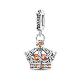 Detailed close-up of a silver crown charm with orange amber stone and tiny zircons