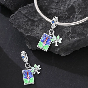 Detail of silver Tarot Magician charm with blue enamel and Tree of Life on a bracelet