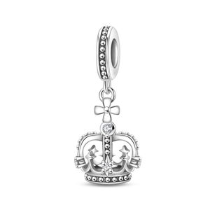 Detailed macro view of silver crown charm with hollow design and sparkling zircon stones