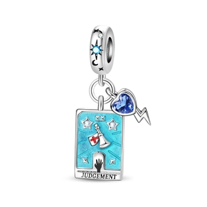 Macro detail of Tarot Judgement charm with blue heart zircon and lightning pendant