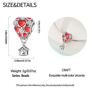 Detail view of heart balloon charm with zircon stones and dimensions 1.68cm by 0.94cm