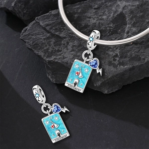 Detail of Judgement tarot charm with blue enamel and crystal for bead bracelets