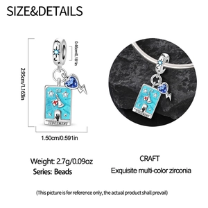 Macro view of silver Judgement Tarot charm with blue enamel and lightning bolt detail