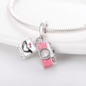 Detailed view of silver-plated camera charm and Record photo pendant on snake chain