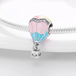 Macro shot of hot air balloon charm with colorful enamel and pavé zircon on silver chain