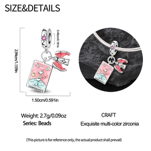 Macro view of Tarot Temperance charm in silver with pink enamel and winged angel detail
