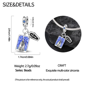 Macro detail of Death Tarot charm with blue enamel and colorful cubic zirconia