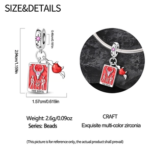 Detail view of The Devil tarot charm bead with red enamel heart and S925 silver finish