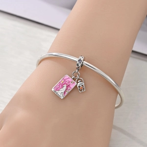 Detail of silver Tarot Hermit charm and lantern pendant with orange zircon on bangle