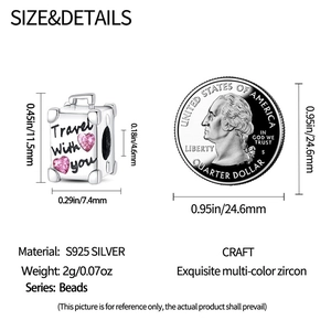 Silver travel suitcase charm detail showing size measurements and a coin for scale