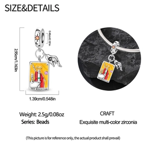 Macro detail of Tarot Magician charm bead with yellow enamel and multicolored zircons