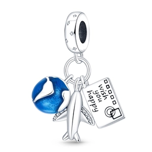 Macro detail of silver travel charms including a blue globe, airplane, and camera tag