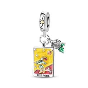 Detailed close-up of The Fool tarot card charm with enamel colors and a silver rose