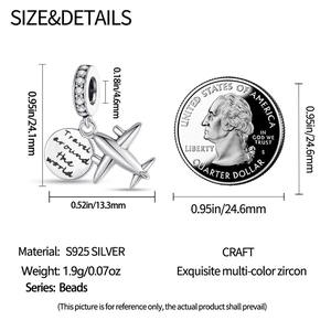Macro view of airplane and world travel charm with size scale against a quarter coin