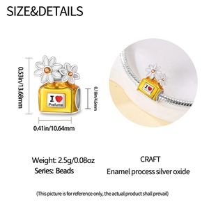 Detail of yellow perfume bottle charm with daisies and exact size measurements