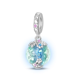 Detailed close-up of luminous firefly charm with blue-green starry glass and pink zircon