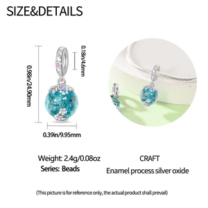 Detailed blue firefly charm with silver floral engraving and colorful gemstone accents