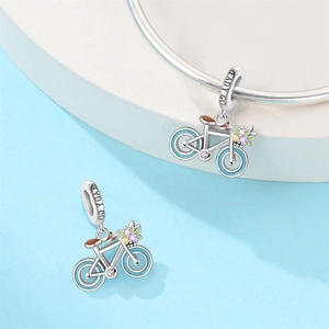 Silver bicycle charm pendant with blue enamel wheels and colorful zircon flowers