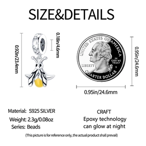 Detailed view of luminous firefly charm dimensions with US quarter coin for size reference
