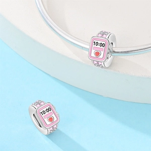 Detailed silver watch charm with pink enamel, sparkling crystals, and red heart dial