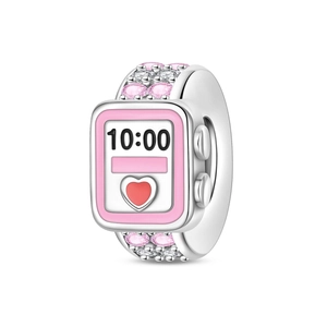 Detailed macro view of silver-plated smart watch charm with pink crystals and 10:00 dial