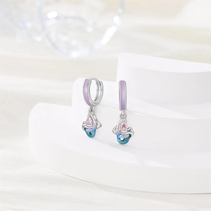 Detailed close-up of mermaid tail earrings with purple enamel and pink pear-cut zircon