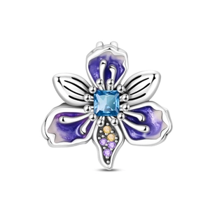 Close-up of iris flower charm with blue gemstone and purple enamel petals in silver