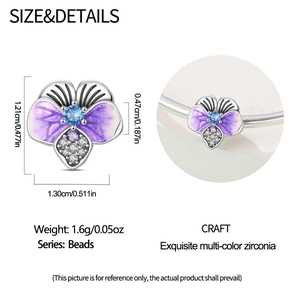 Macro detail of pansy flower charm with purple enamel and zircon inlay showing exact dimensions