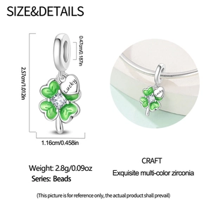 Detailed view of silver lucky four-leaf clover charm with green enamel and white zircon stone