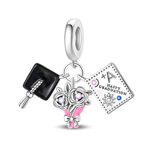Detail of silver owl graduation charm with mortarboard and Happy Graduation engraving