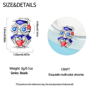 Detailed graduation owl charm with blue enamel eyes and red apple shown with dimensions