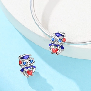Silver owl graduation charm with doctoral cap and red heart on a snake chain bracelet