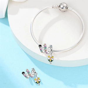 Silver snake chain bracelet featuring colorful gemstone beads and a floral enamel pendant