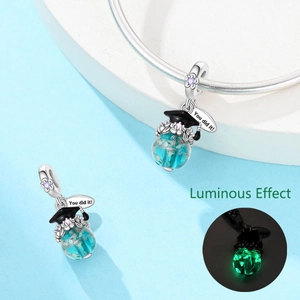 Luminous owl charm with black graduation cap and You did it! engraving detail