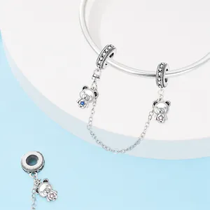 Detailed macro view of S925 sterling silver bear safety chain with colorful zircons