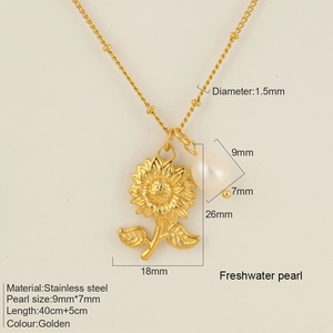 Detail view of golden sunflower pendant necklace with dimensions and freshwater pearl