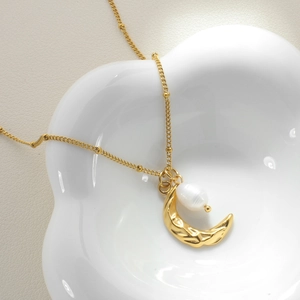 Elegant gold hammered moon necklace with freshwater pearl and delicate beaded chain