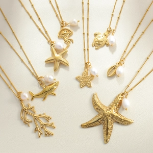 Set di collane marine con ciondoli a stella marina e tartaruga in oro e perle