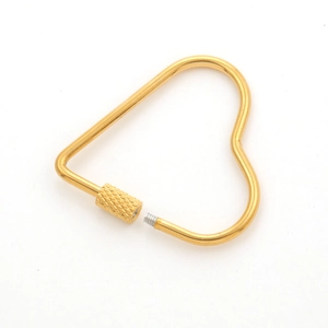 Detail showing a heart-shaped golden stainless steel screw clasp with textured grip