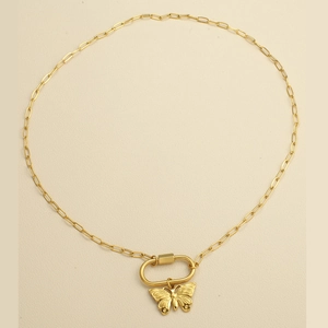 Detail of gold butterfly pendant on a stylish paperclip chain with oval carabiner lock