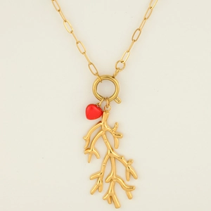 Close-up of golden stainless steel necklace with coral branch pendant and red heart.