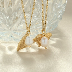 Elegant gold stainless steel necklace with irregular pendant and white baroque pearl