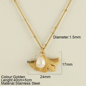Golden stainless steel necklace featuring a brushed ginkgo leaf and white pearl pendant