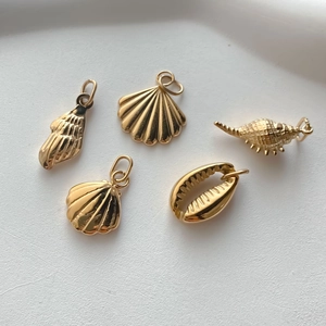Golden stainless steel ocean pendants set with shell and conch charms for DIY jewelry