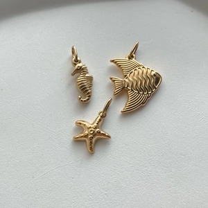 Polished gold stainless steel sea horse, tropical fish and starfish pendants