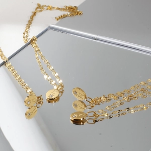 14K gold plated stainless steel necklace with oval initial pendants and zircon stones